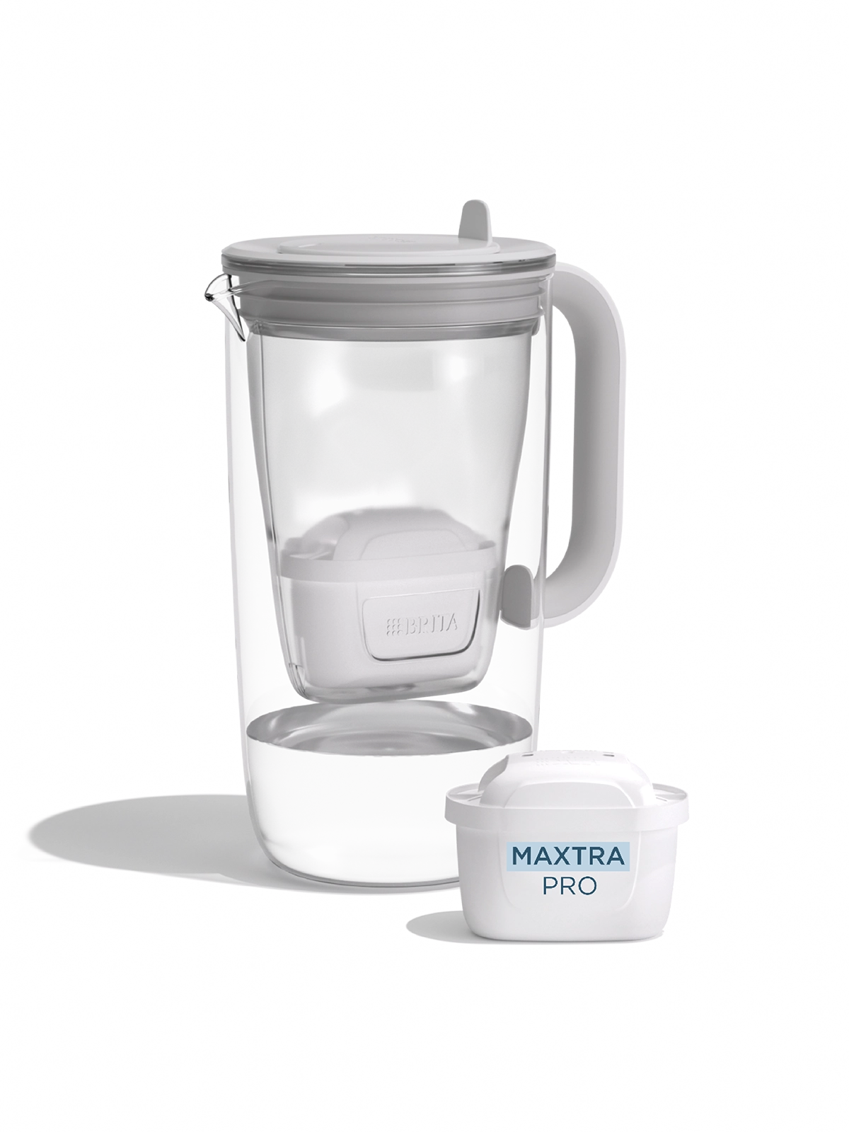 A water filter glass jug in grey on a white background