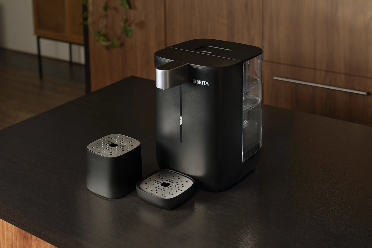 BRITA Home YOURCE mini Water Dispenser with drip tray accessories on a kitchen countertop